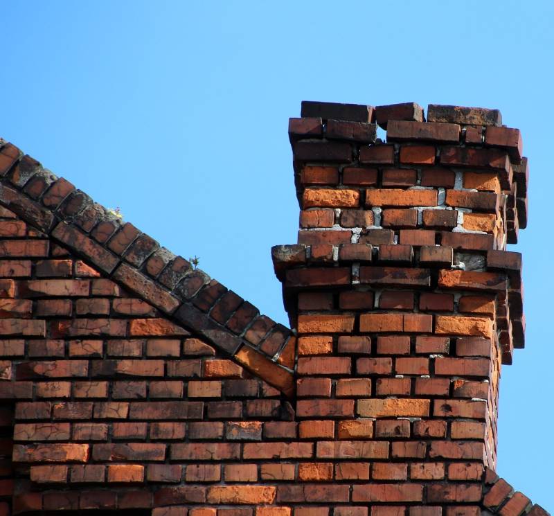 Damaged chimney on an La Canada home showing cracks and missing mortar